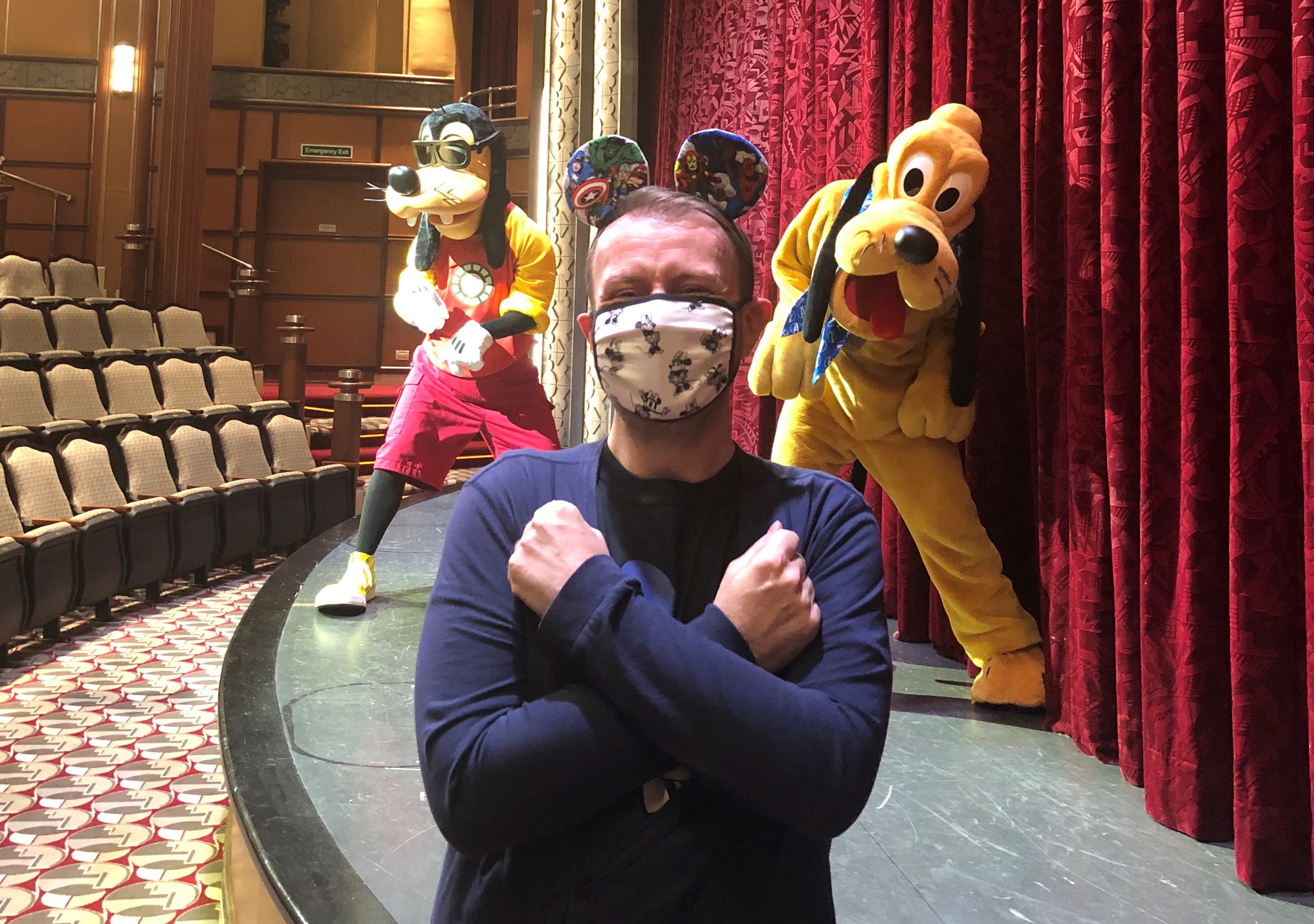 Damon Smith on a selfie spot with Goofy and Pluto in the Buena Vista Theatre of the Disney Magic (PA/Damon Smith)