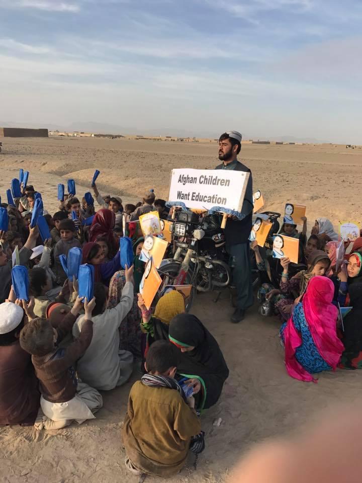 Wesa, director of Pen Path foundation in Afghanistan, is seen teaching children in a village in Kandahar’s Spin Boldak district