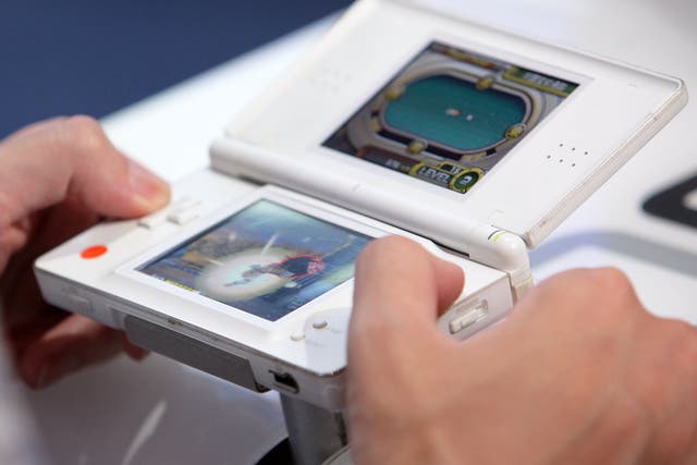 <p>ANintendo DS is played at the 2010 Tokyo Game Show</p>