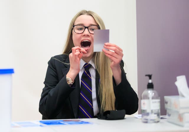 <p>A student takes a lateral flow test at a school in Doncaster, Yorkshire, in March 2021. </p>