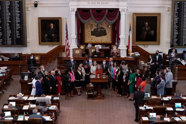 <p>In this May 5, 2021, file photo, Texas state Rep. Donna Howard, D-Austin, center at lectern, stands with fellow lawmakers in the House Chamber in Austin, Texas, as she opposes a bill introduced that would ban abortions as early as six weeks and allow private citizens to enforce it through civil lawsuits, under a measure given preliminary approval by the Republican-dominated House</p>