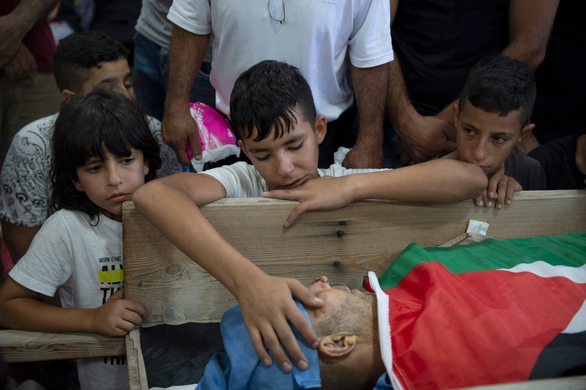 Palestinians mourn man found shot in West Bank, blame Israel