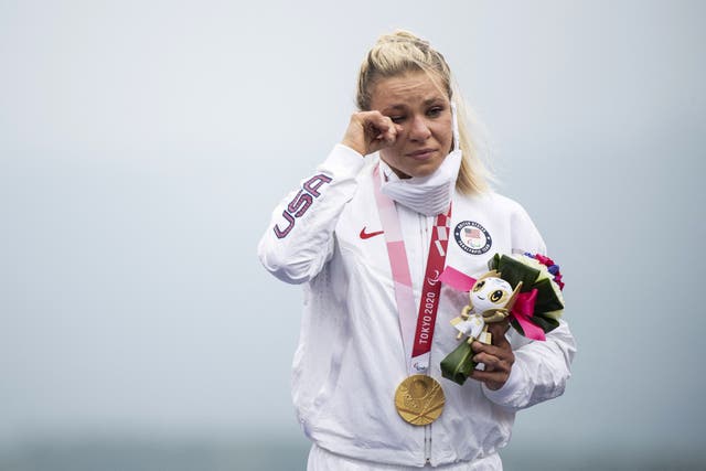 <p>Gold medallist Oksana Masters of the US reacts on the podium after competing in the women's cycling road individual H4-5 time trial during the Tokyo 2020 Paralympic Games at the Fuji International Speedway in Oyama on August 31, 2021. </p>