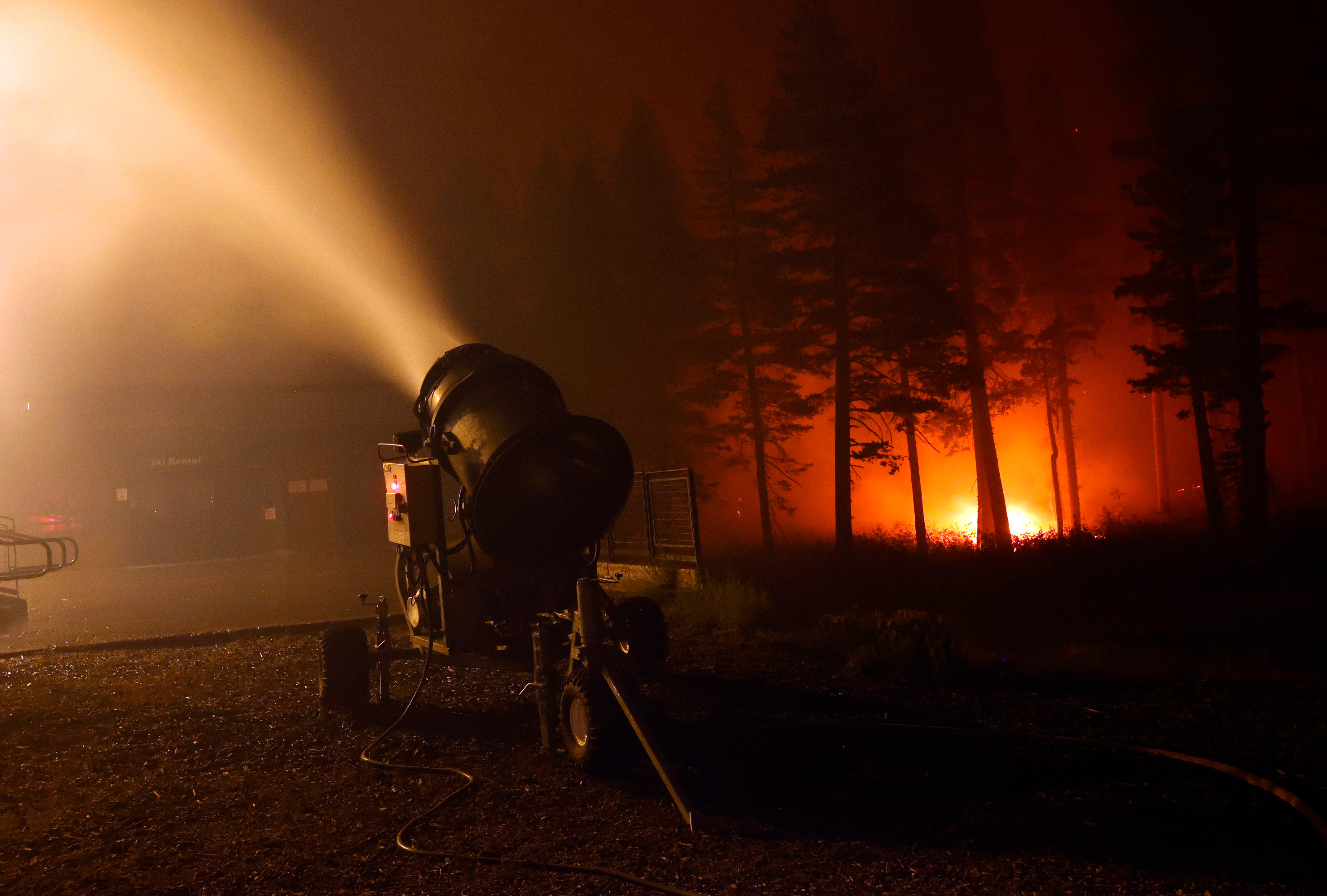 <p>Ski resort staff in Lake Tahoe, California have been pumping water from snow guns onto buildings and vegetation </p>