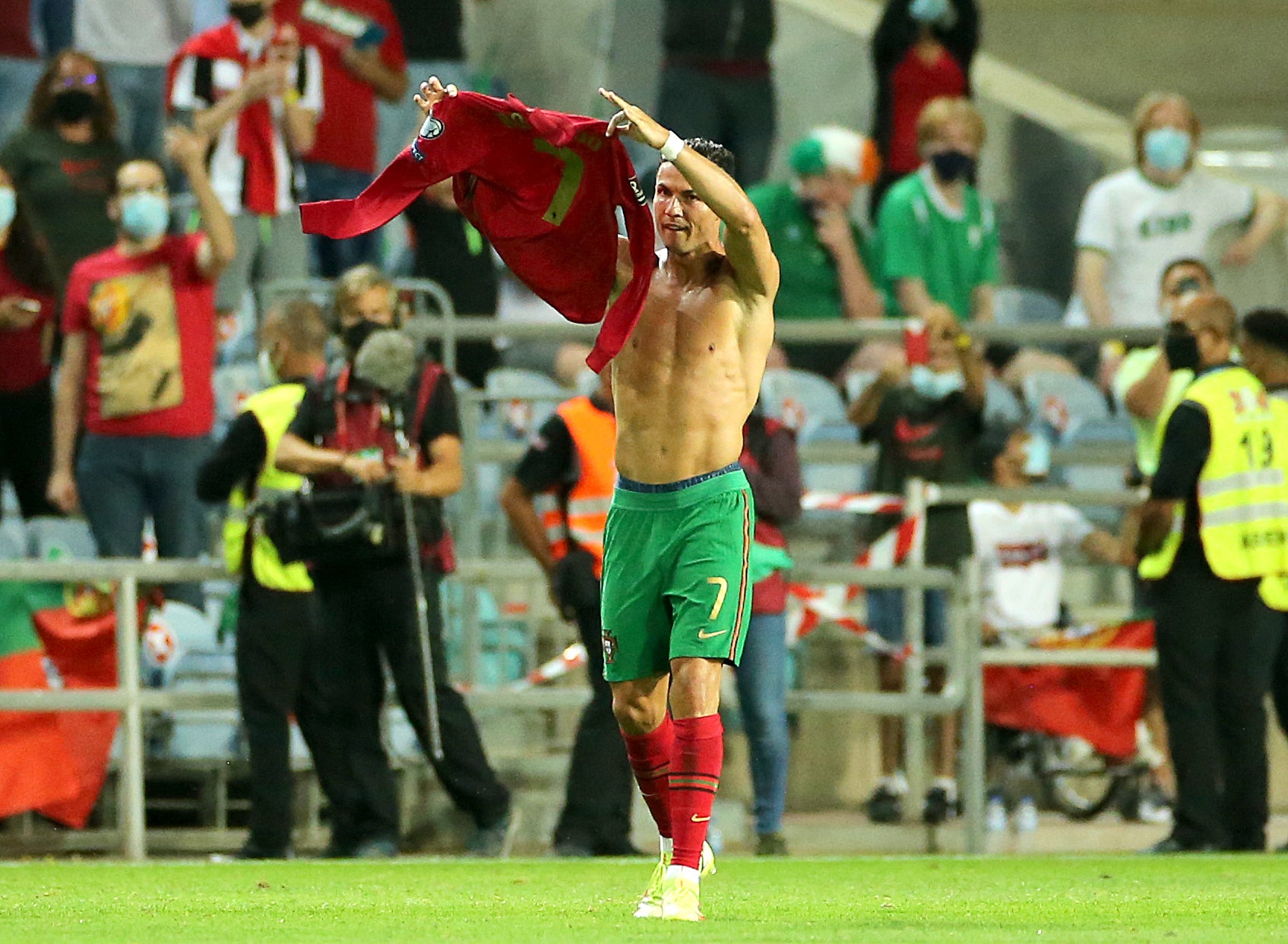 Portugal’s Cristiano Ronaldo holds up his shirt to to the fans after scoring his sides second goal during the 2022 FIFA World Cup Qualifying match at the Estadio Algarve, Portugal. Picture date: Wednesday September 1, 2021.