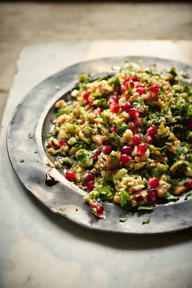 Claudia Roden’s green olive, walnut and pomegranate salad (Susan Bell/PA)