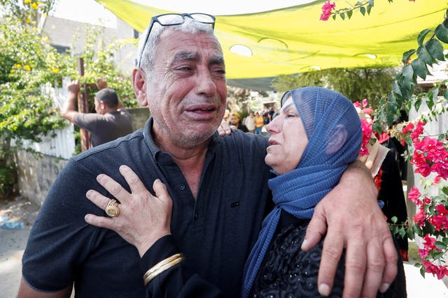 <p>Mourners cry during the funeral of Palestinian Raed Jadallah, who was shot dead by Israeli forces, according to health ministry, near Ramallah in the Israeli-occupied West Bank</p>
