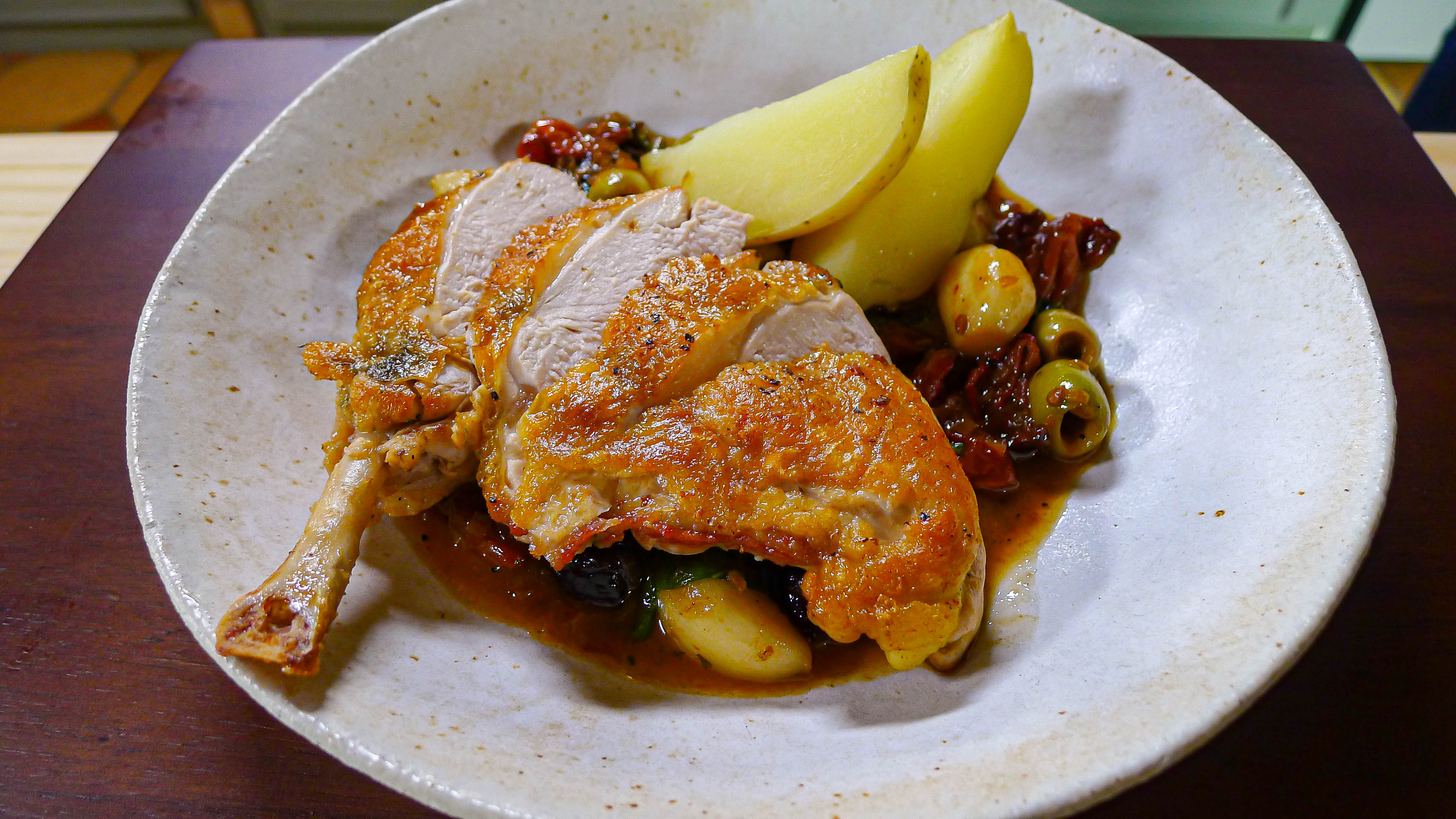 A guinea fowl dish with olives