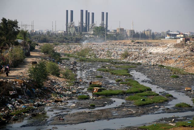 <p>Raw sewage flowing near the main Gaza Strip power plant, serving the Hamas-run Palestinian occupied territories, south of Gaza City in 2019</p>