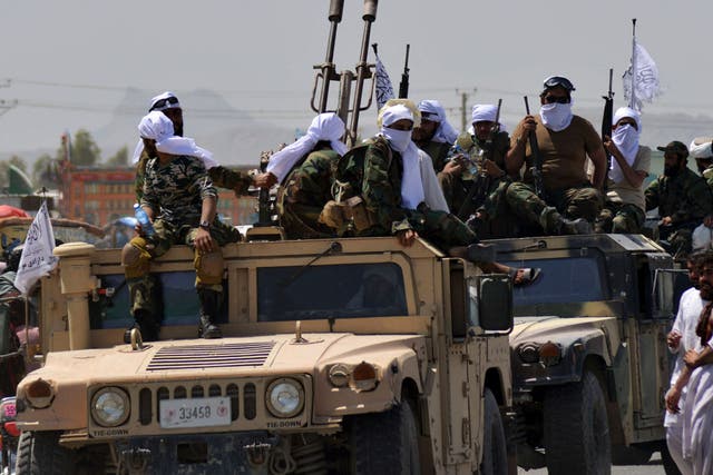 <p>Taliban fighters atop Humvee vehicles parade along a road to celebrate after the US pulled all its troops out of Afghanistan, in Kandahar last week </p>