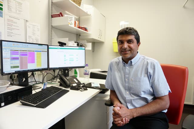 <p>GP data sharing - Dr Osman Bhatti in his office at St Andrews Health Centre, Bromley-By-Bow, Tower Hamlets</p>