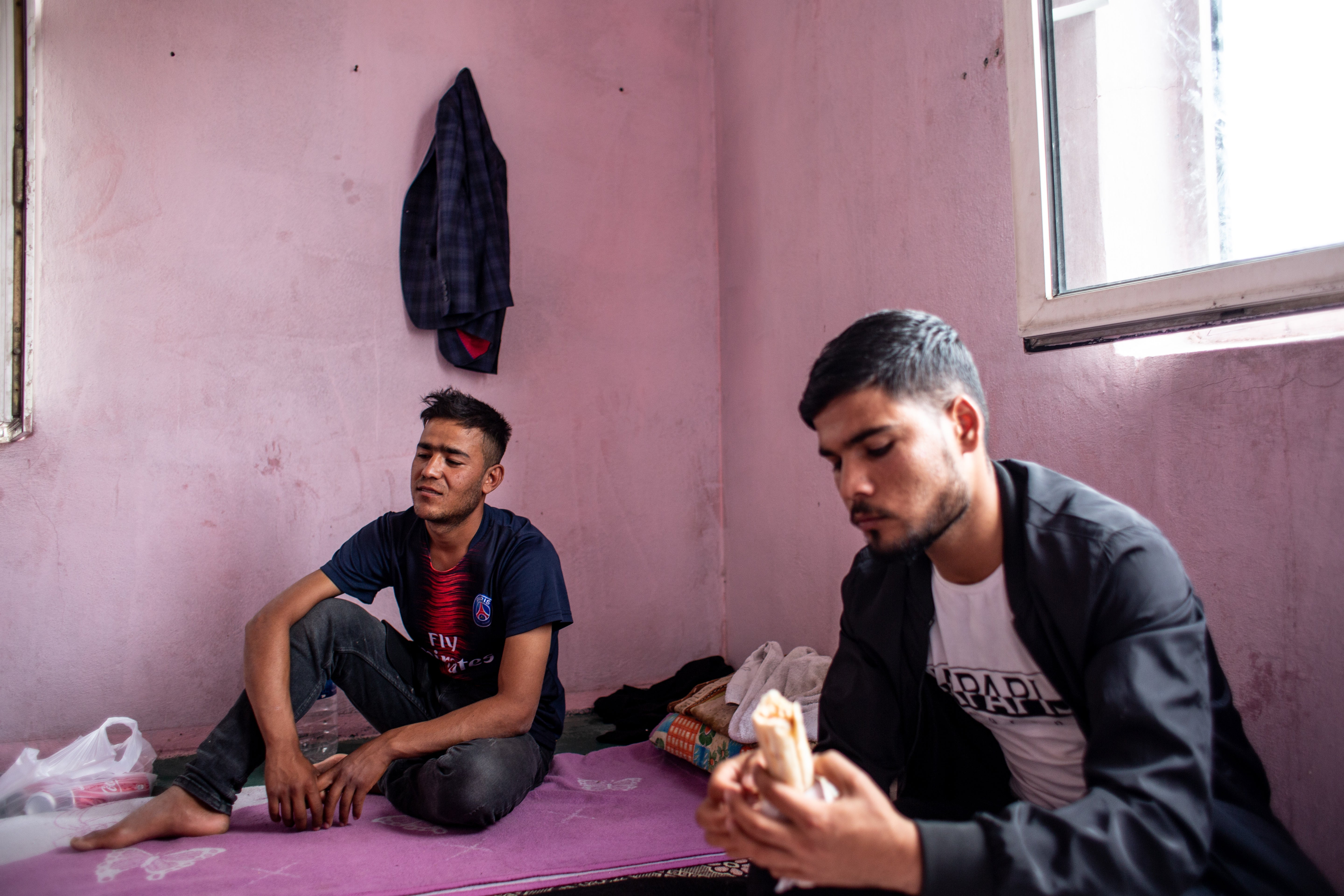 Abdullah Matin (17) and Dost-Mohammad (21), Afghan refugees in Van, are seen in the abandoned building they live in