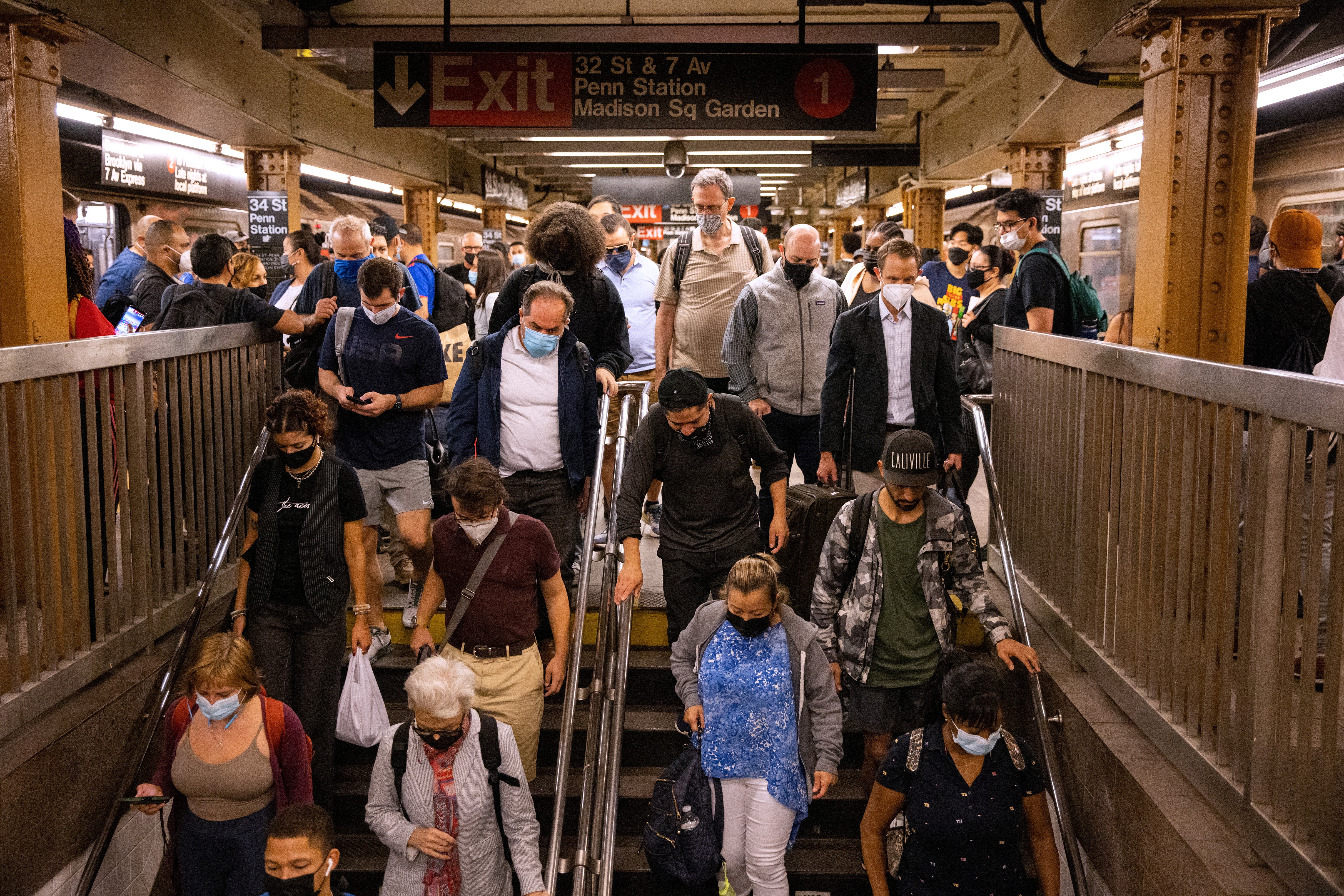 Commuters deal with delays caused by heavy rainfall and flooding in the New York City subway during the morning rush after the remnants of Tropical Storm Ida brought drenching rain and the threat of flash floods to parts of the northern mid-Atlantic, in New York City