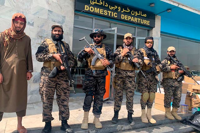 <p>Taliban fighters stand guard inside the Hamid Karzai International Airport after the US withdrawal in Kabul, Afghanistan on 31 August 2021 </p>