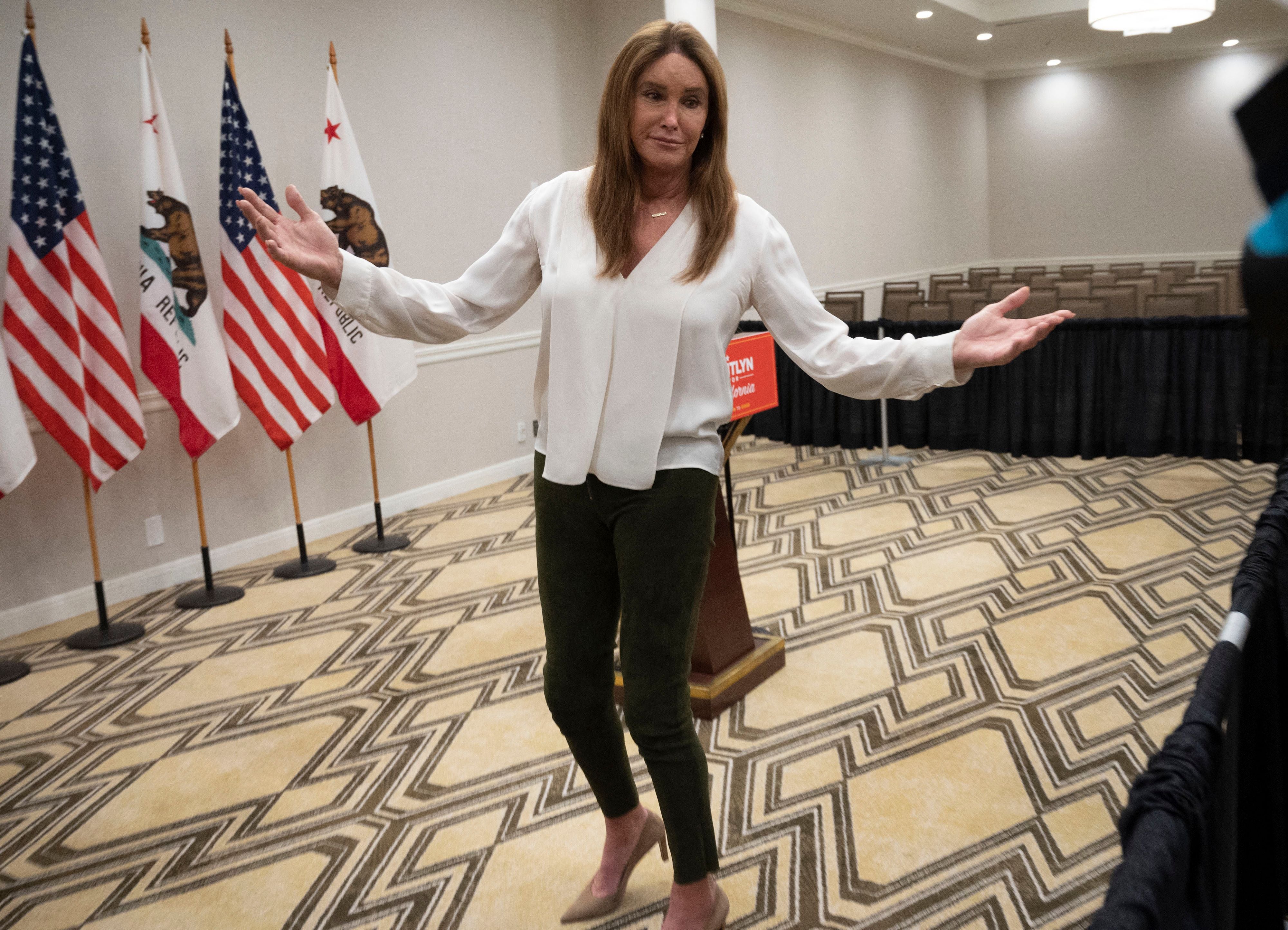 Gubernatorial candidate Caitlyn Jenner gestures while speaking to reporters after a Town Hall meeting in Pasadena, California, August 28, 2021, as she campaigns to replace California Gov. Gavin Newsom in the upcoming special recall election