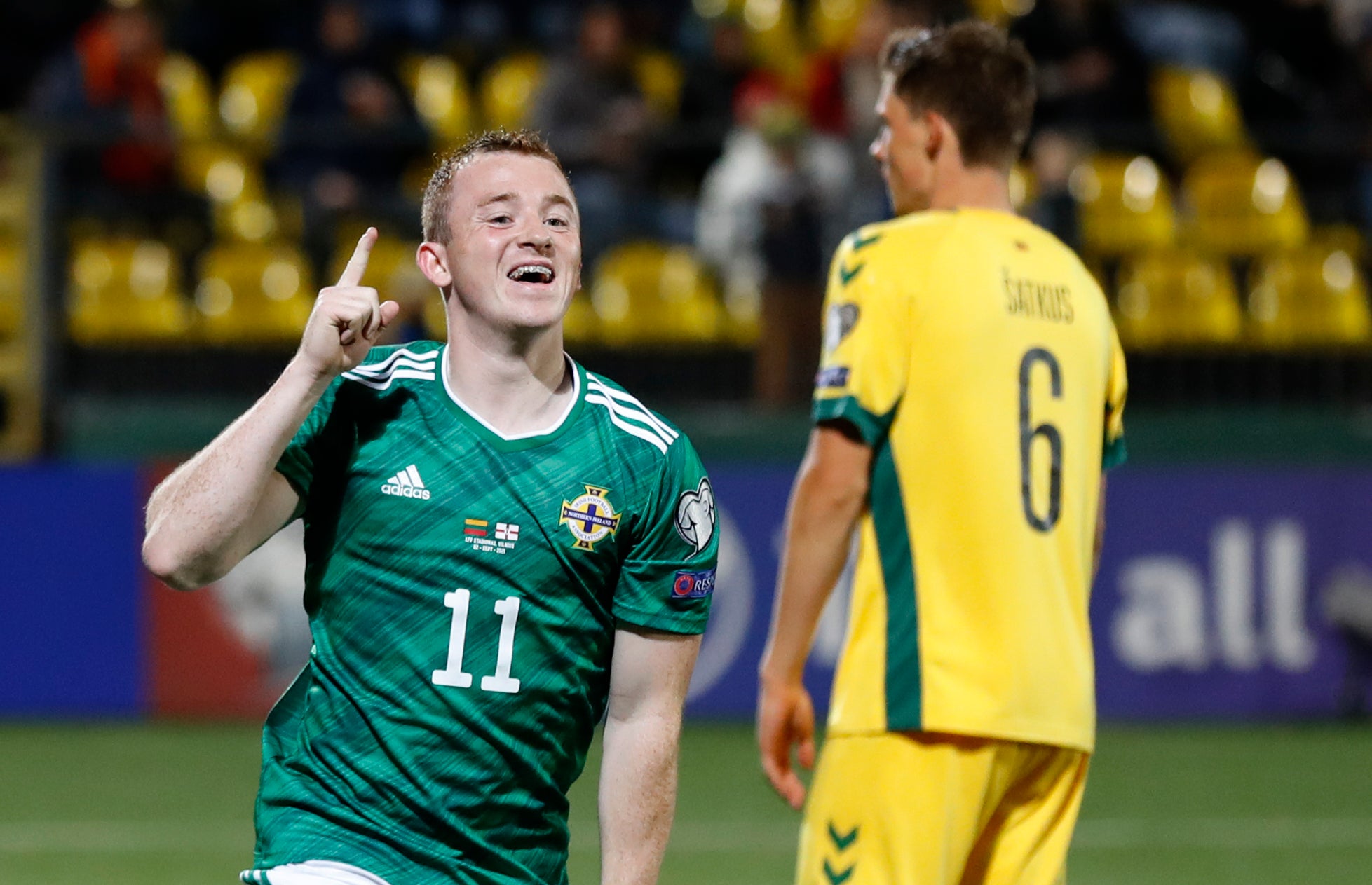 Shayne Lavery celebrates his goal in Lithuania (Mindaugas Kulbis/AP)