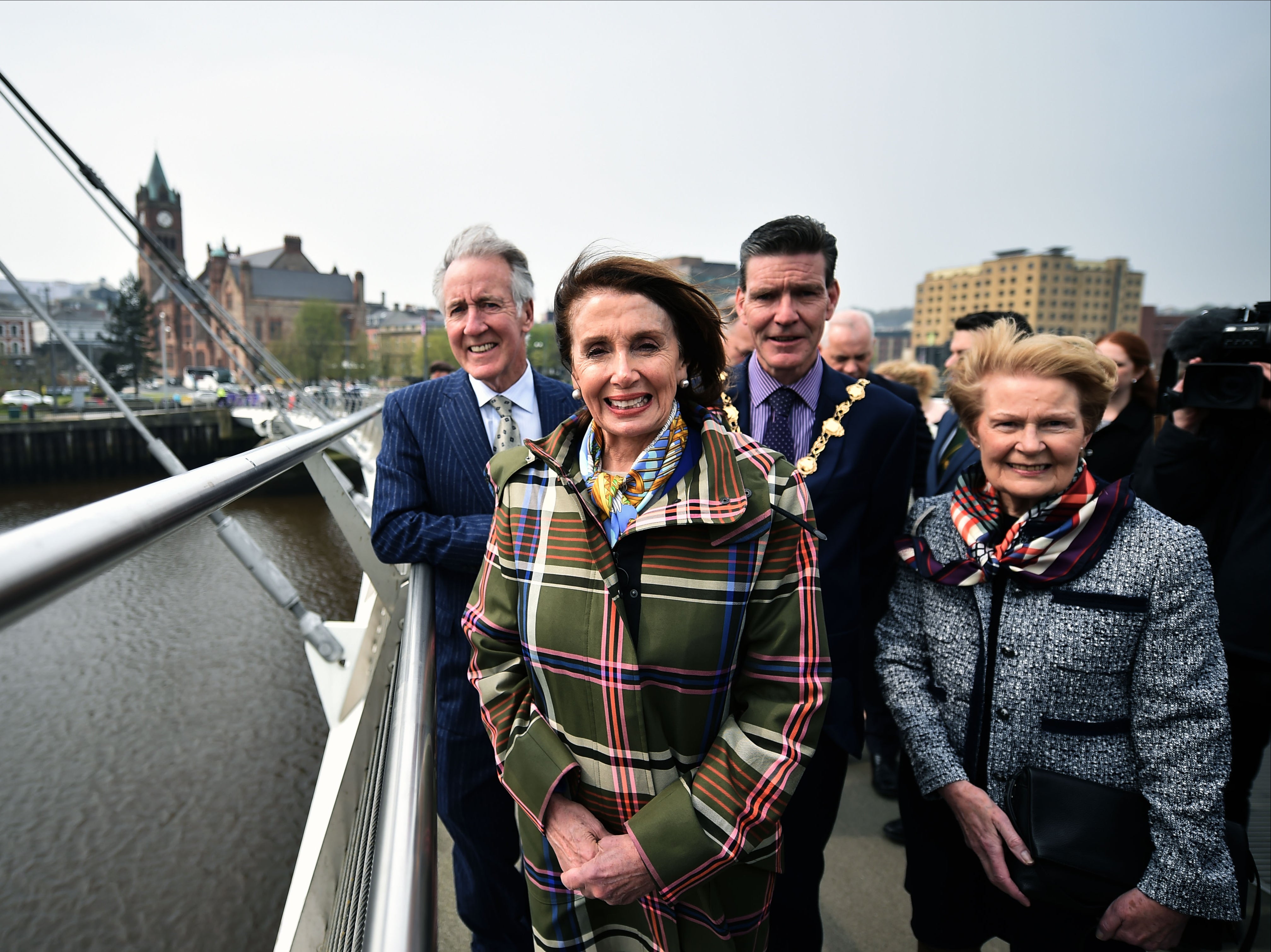 Pat Hume and Derry City mayor John Boyle standing with US House Speaker Nancy Pelosi on Derry’s Peace Bridge in 2019