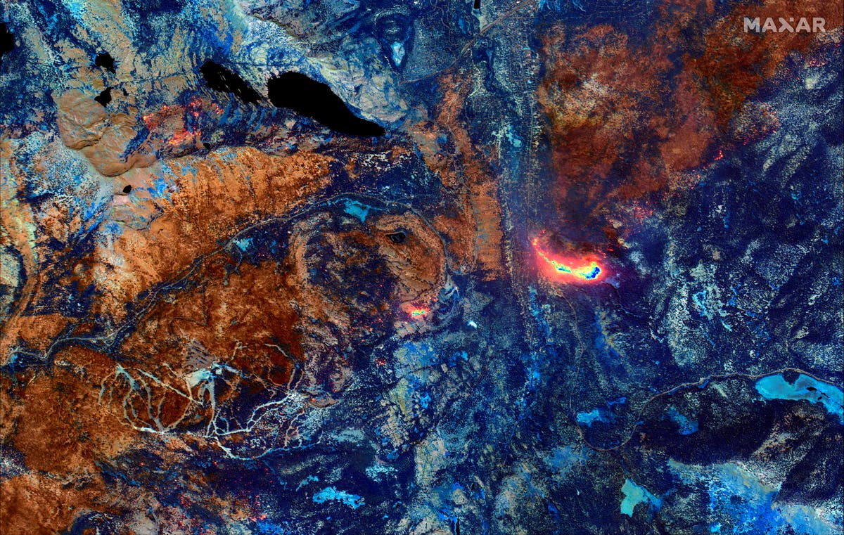 Calmer winds aid California fire fight but hot weekend looms