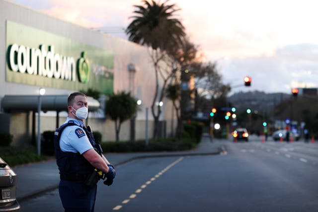 <p>Police guard the area around Countdown LynnMall after the attack</p>