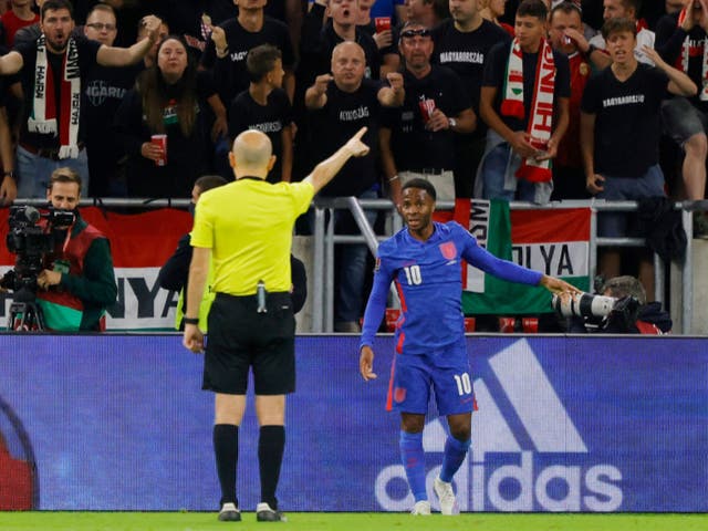 <p>Raheem Sterling speaks to the referee during Thursday’s World Cup qualifier in Budapest </p>