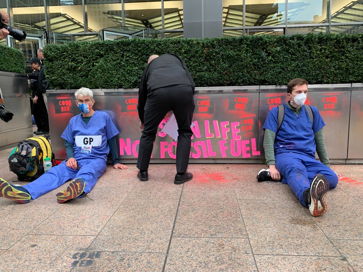 Extinction Rebellion protests – live: Activists strip naked outside Barclays after police remove people glued to plants