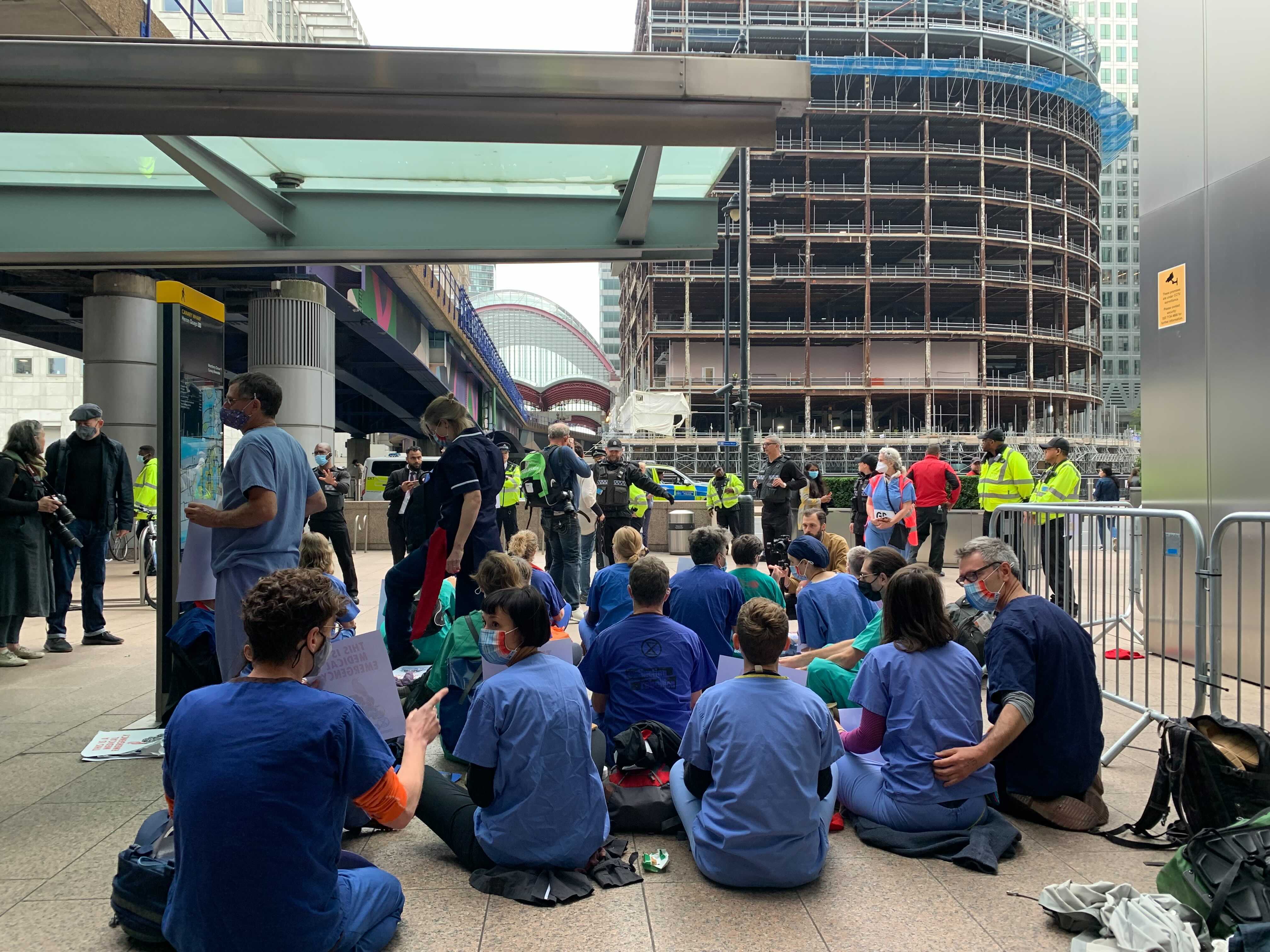 Protesters seen outside a DLR station in east London