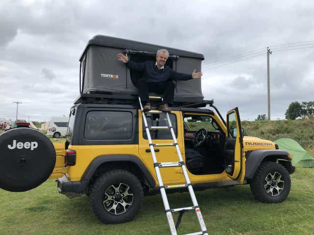 <p>Sean O’Grady takes in the view from his Jeep-mounted TentBox </p>