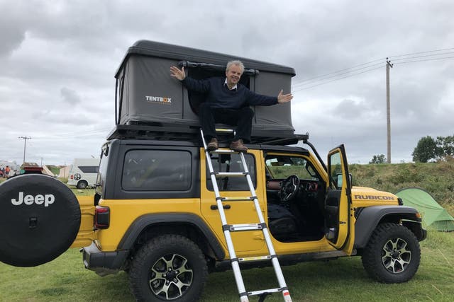 <p>Sean O’Grady takes in the view from his Jeep-mounted TentBox </p>