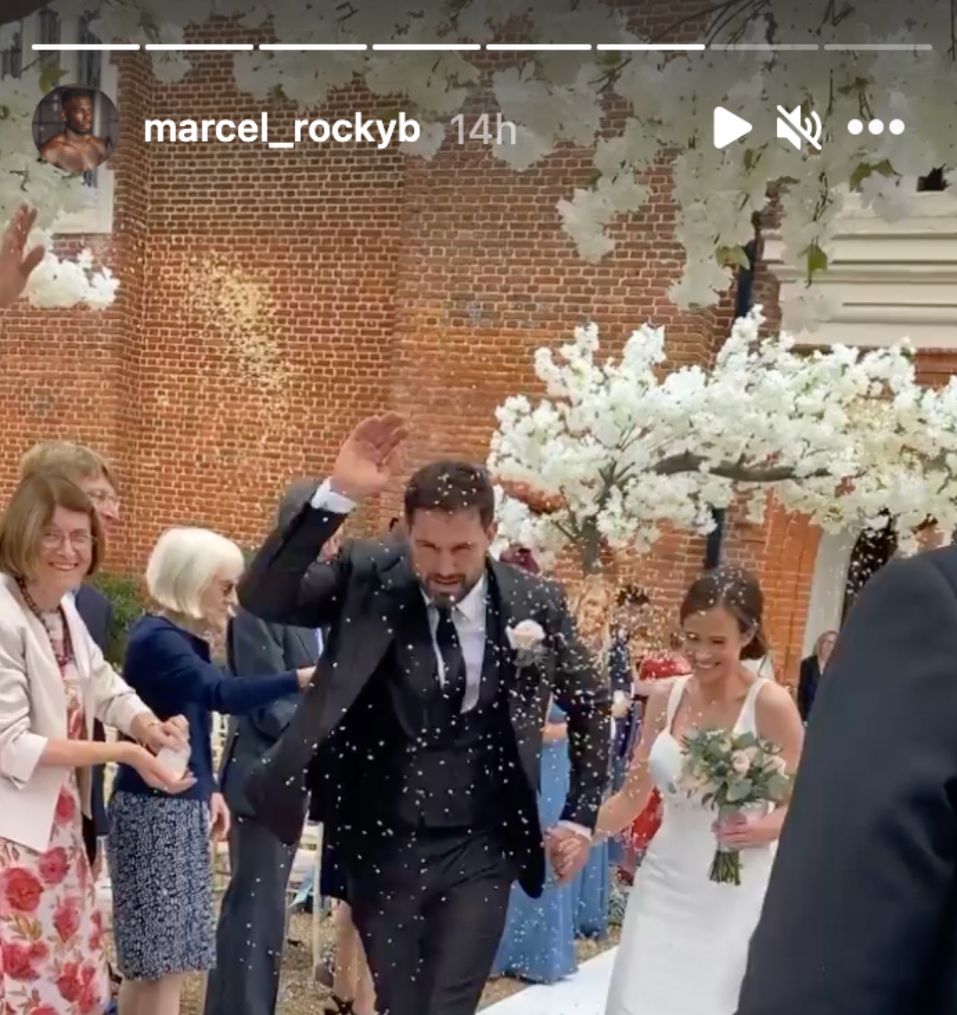 The happy couple are pelted with confetti