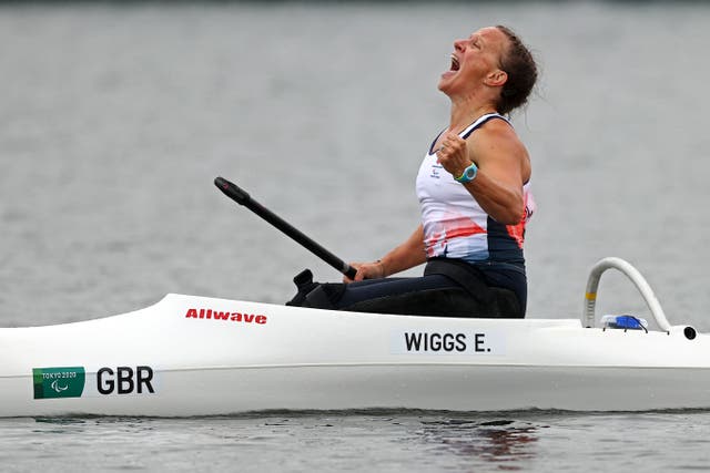 <p>Emma Wiggs celebrates her gold medal</p>