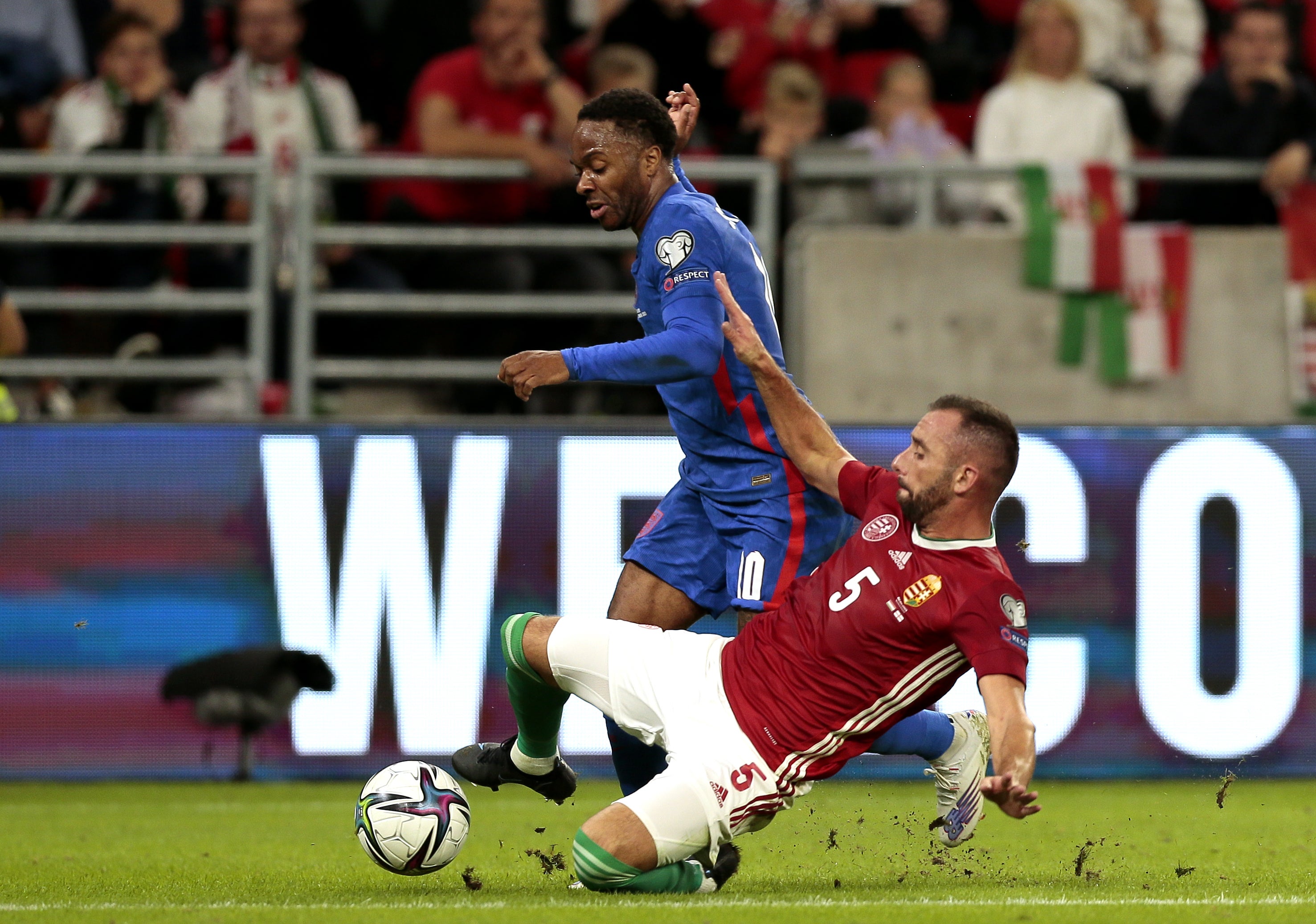 Raheem Sterling, left, was targeted for racist abuse during England’s match in Hungary (Attila Trenka/PA)