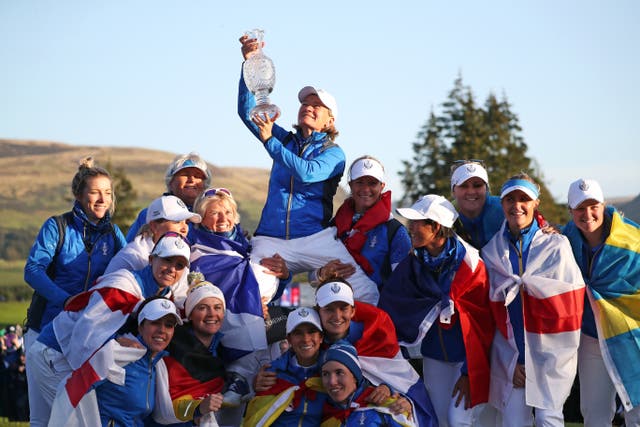Team Europe captain Catriona Matthew (top) celebrates with her team and the trophy after winning the 2019 Solheim Cup (PA)