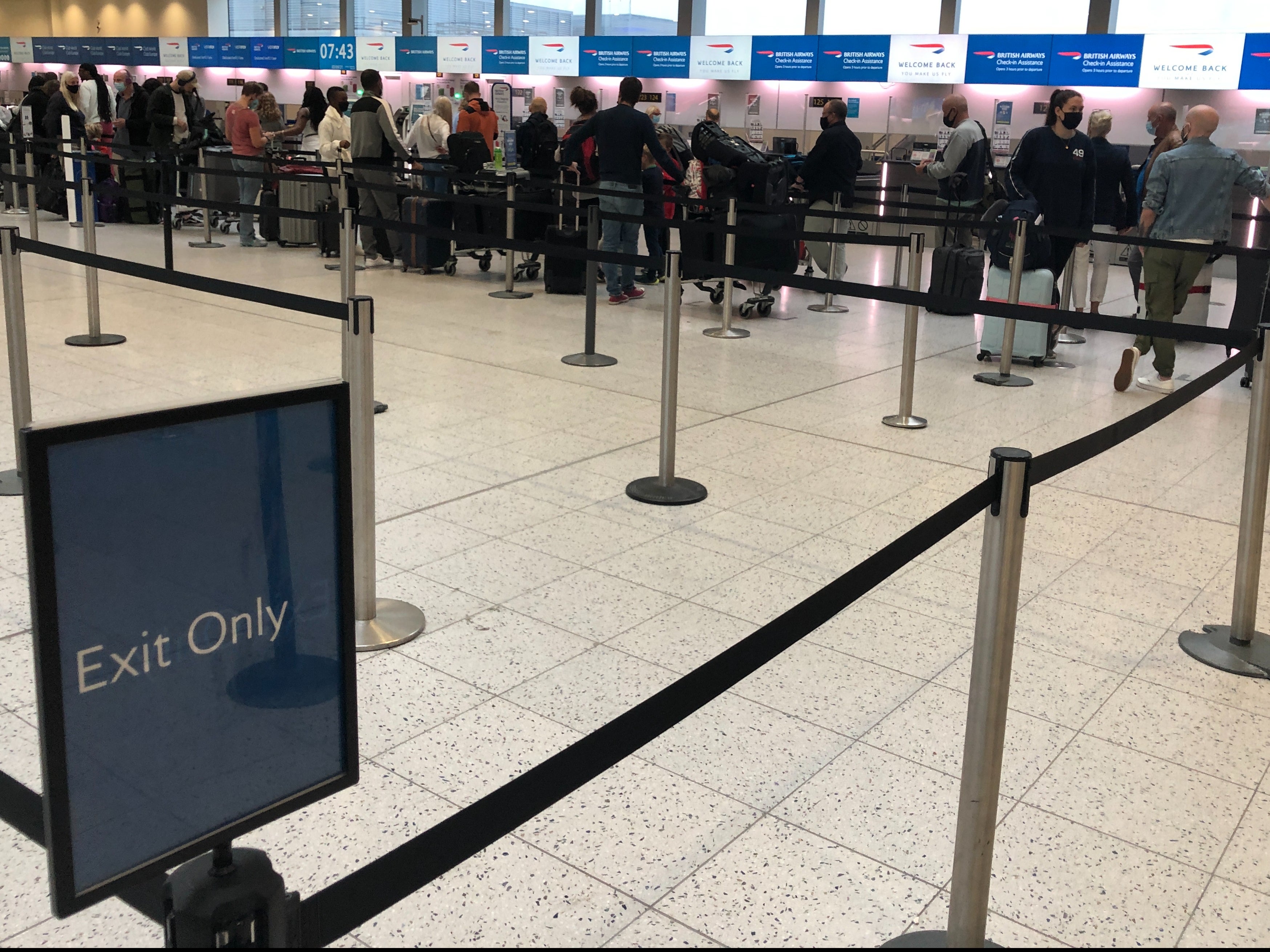 Going places: British Airways long-haul passengers at the temporary check in location at Gatwick North Terminal