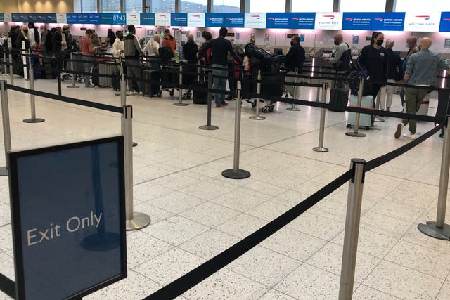 <p>Going places: British Airways long-haul passengers at the temporary check in location at Gatwick North Terminal</p>