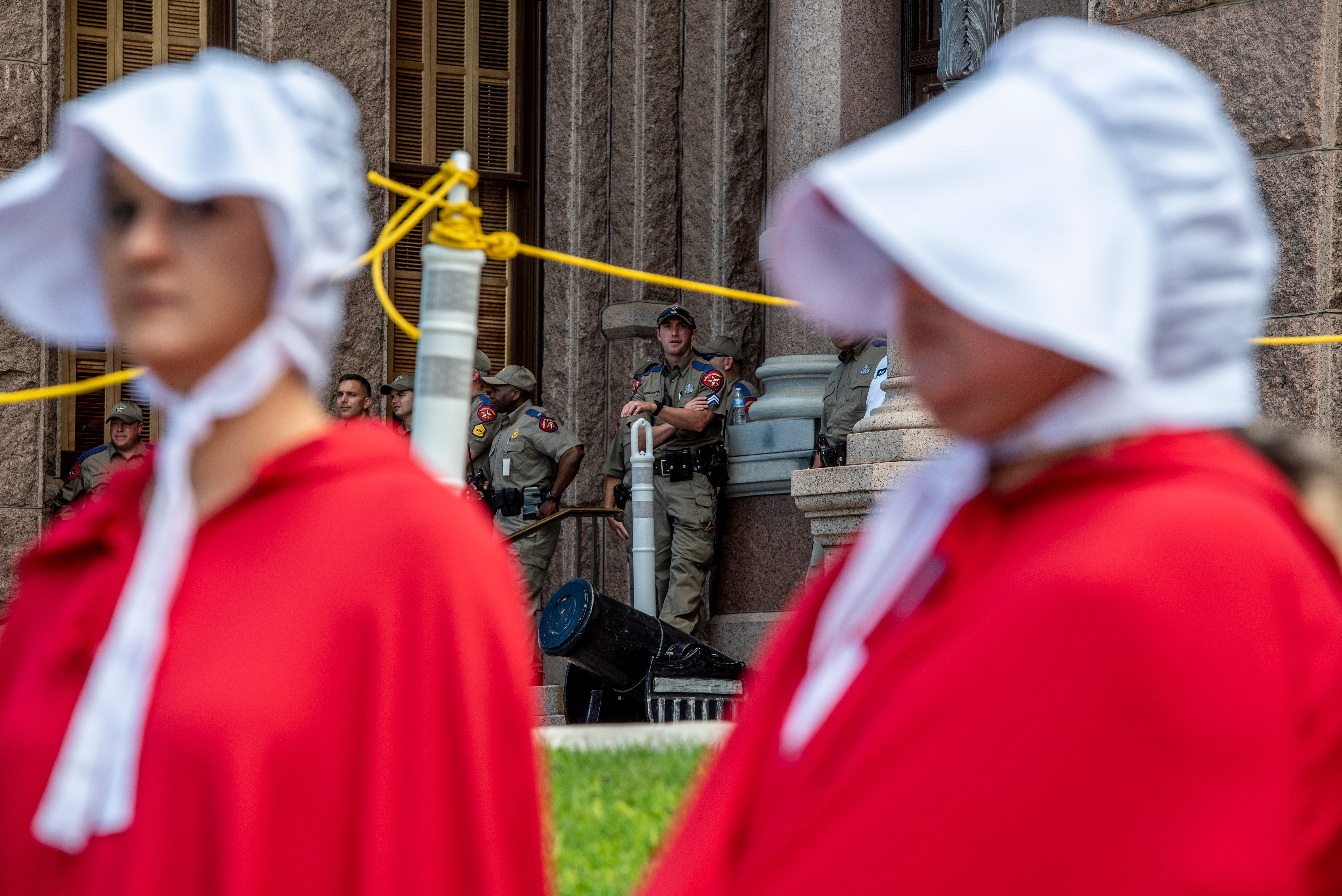 <p>A police officer looks out to a crowd of protesters at a protest outside the Texas state capitol on May 29, 2021 in Austin, Texas.</p>