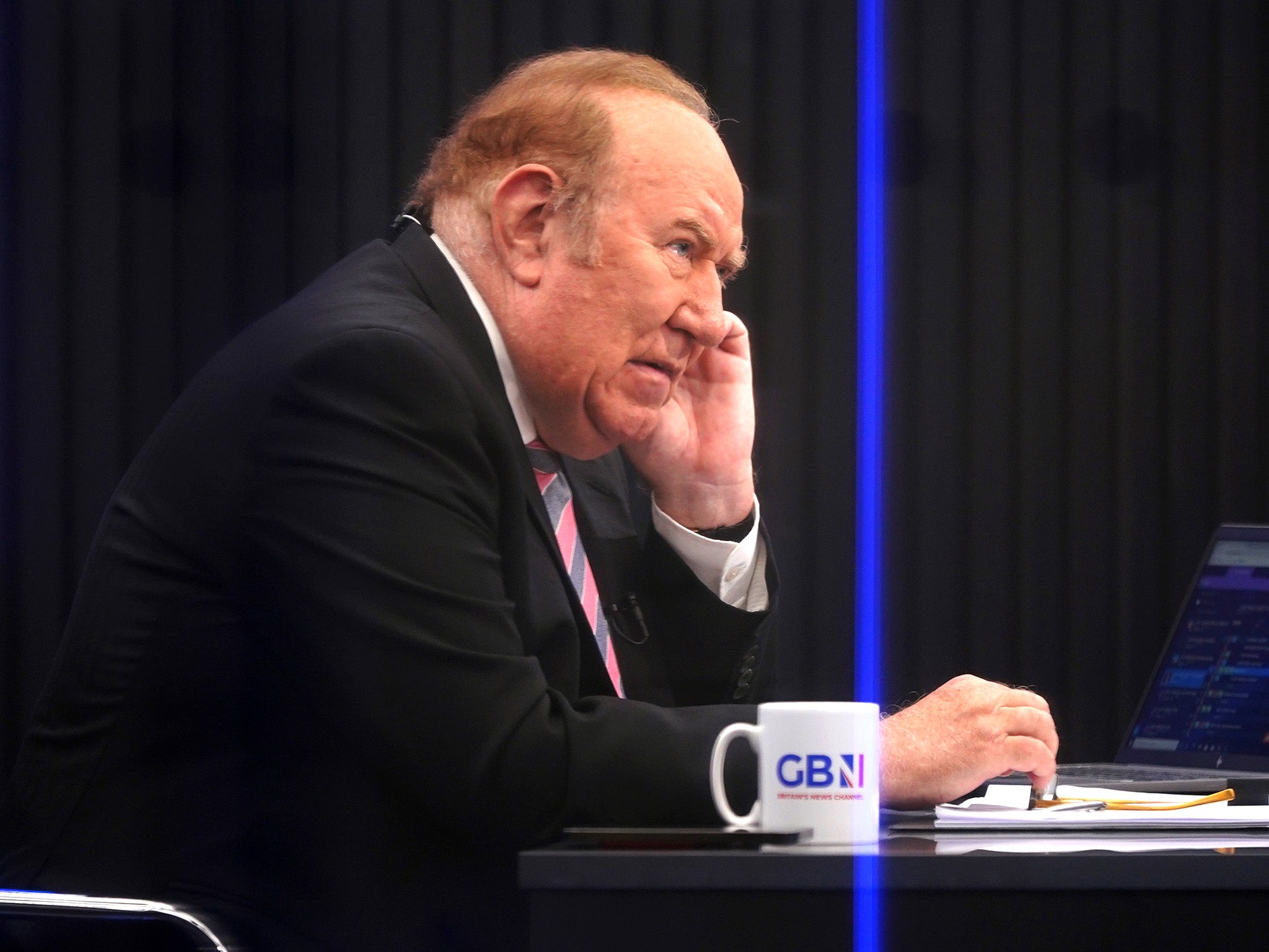 Andrew Neil prepares to broadcast from a studio during the launch event for GB News