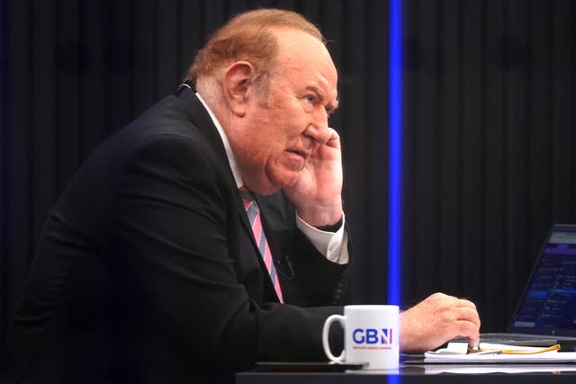 <p>Andrew Neil prepares to broadcast from a studio during the launch event for GB News</p>
