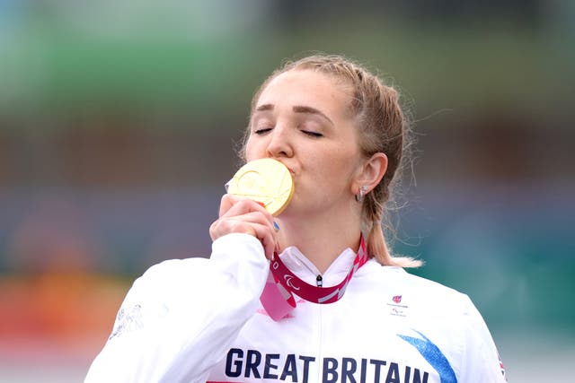 <p>Charlotte Henshaw celebrates with her  Paralympic gold medal</p>