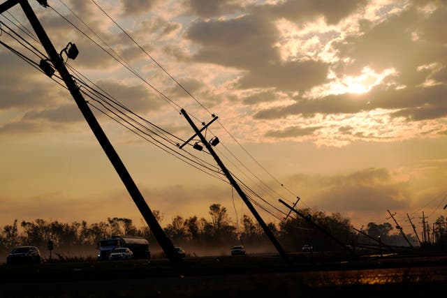 <p>Downed power lines slump over a road in the aftermath of Hurricane Ida in Reserve, Louisiana </p>