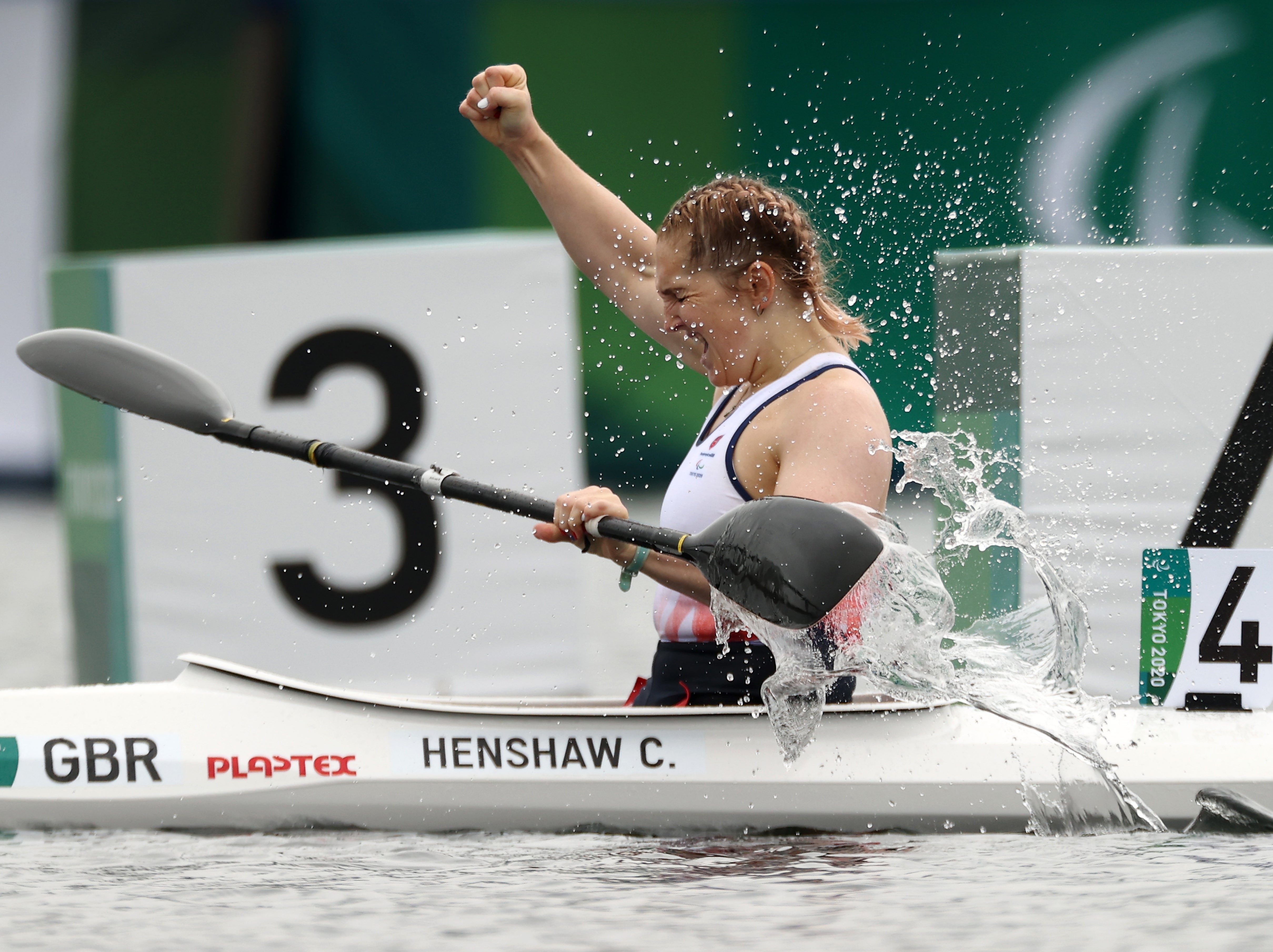 Former swimmer Charlotte Henshaw celebrates her canoeing gold
