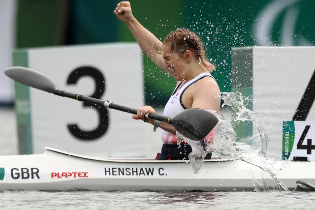 <p>Former swimmer Charlotte Henshaw celebrates her canoeing gold</p>