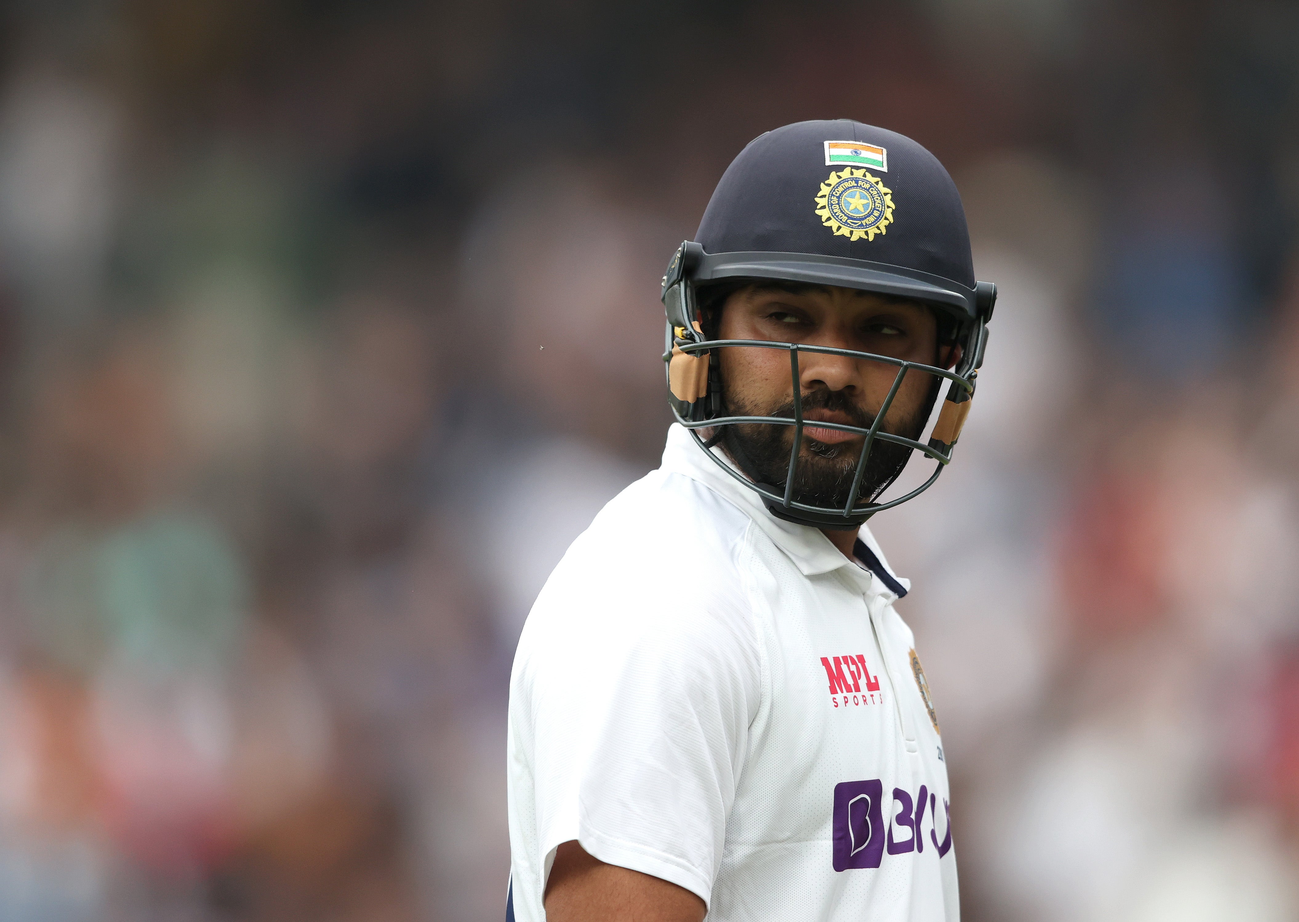 Rohit Sharma of India walks off after losing his wicket