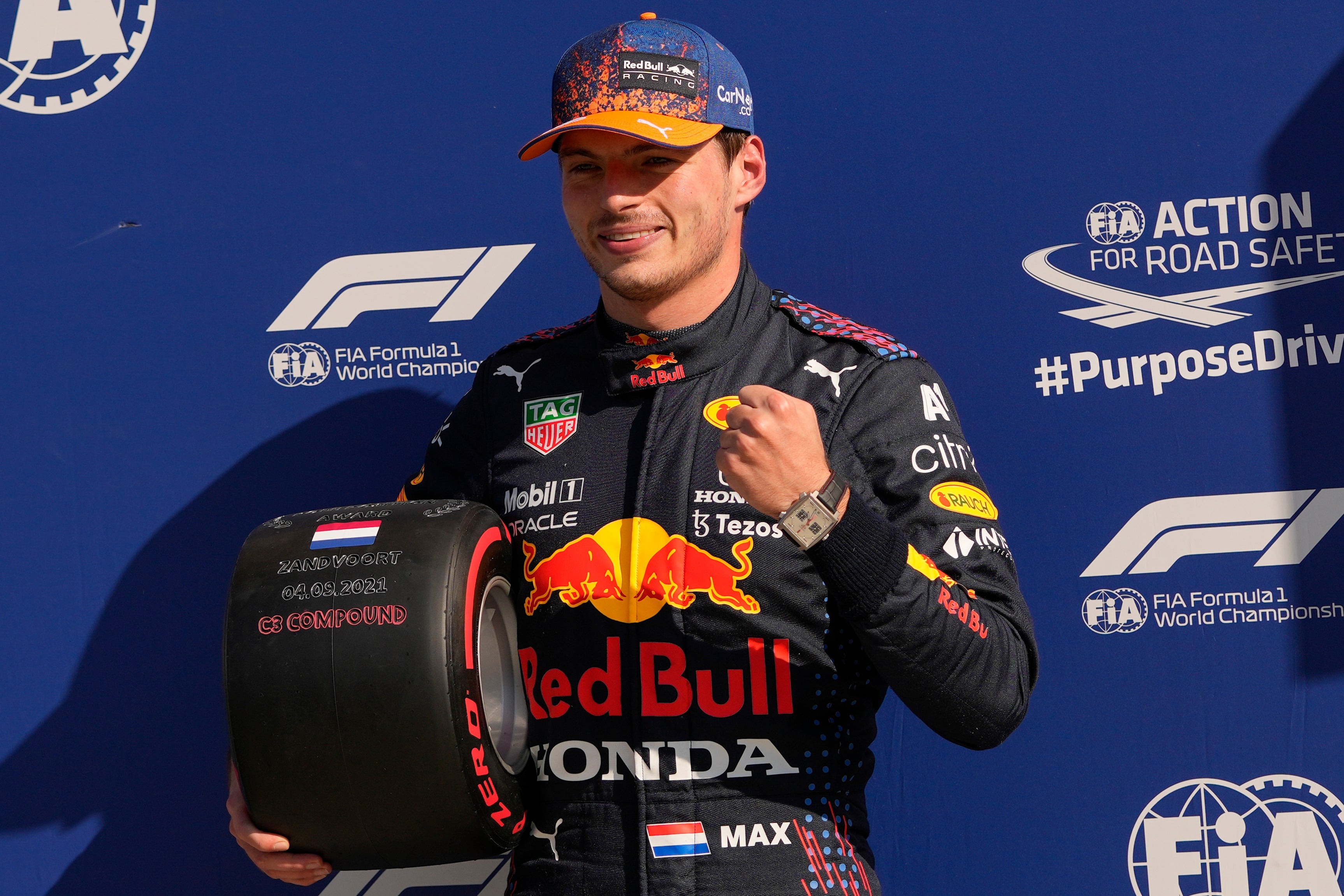 Max Verstappen celebrates after claiming pole position at the Dutch Grand Prix (Francisco Seco/AP)