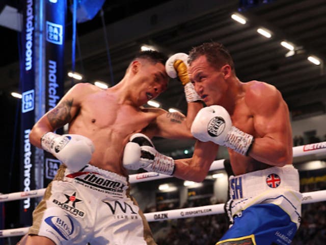 <p>Josh Warrington and Mauricio Lara battle in Leeds</p>