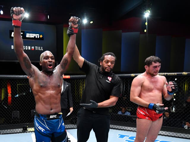 <p>Derek Brunson celebrates after beating Darren Till via submission</p>