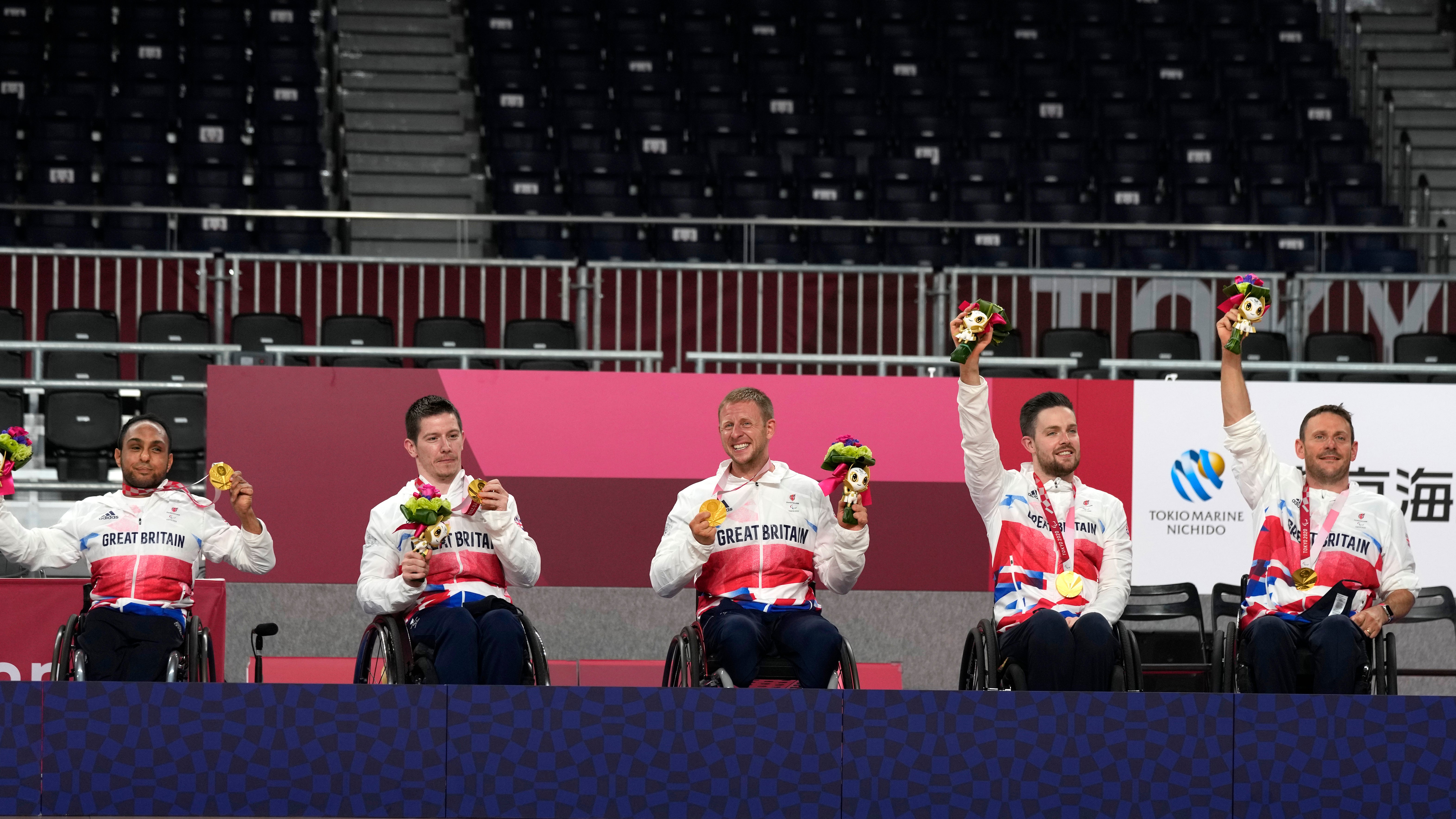 Britain’s wheelchair rugby players receive their gold medals during the awarding ceremony (Shuji Kajiyama/AP)