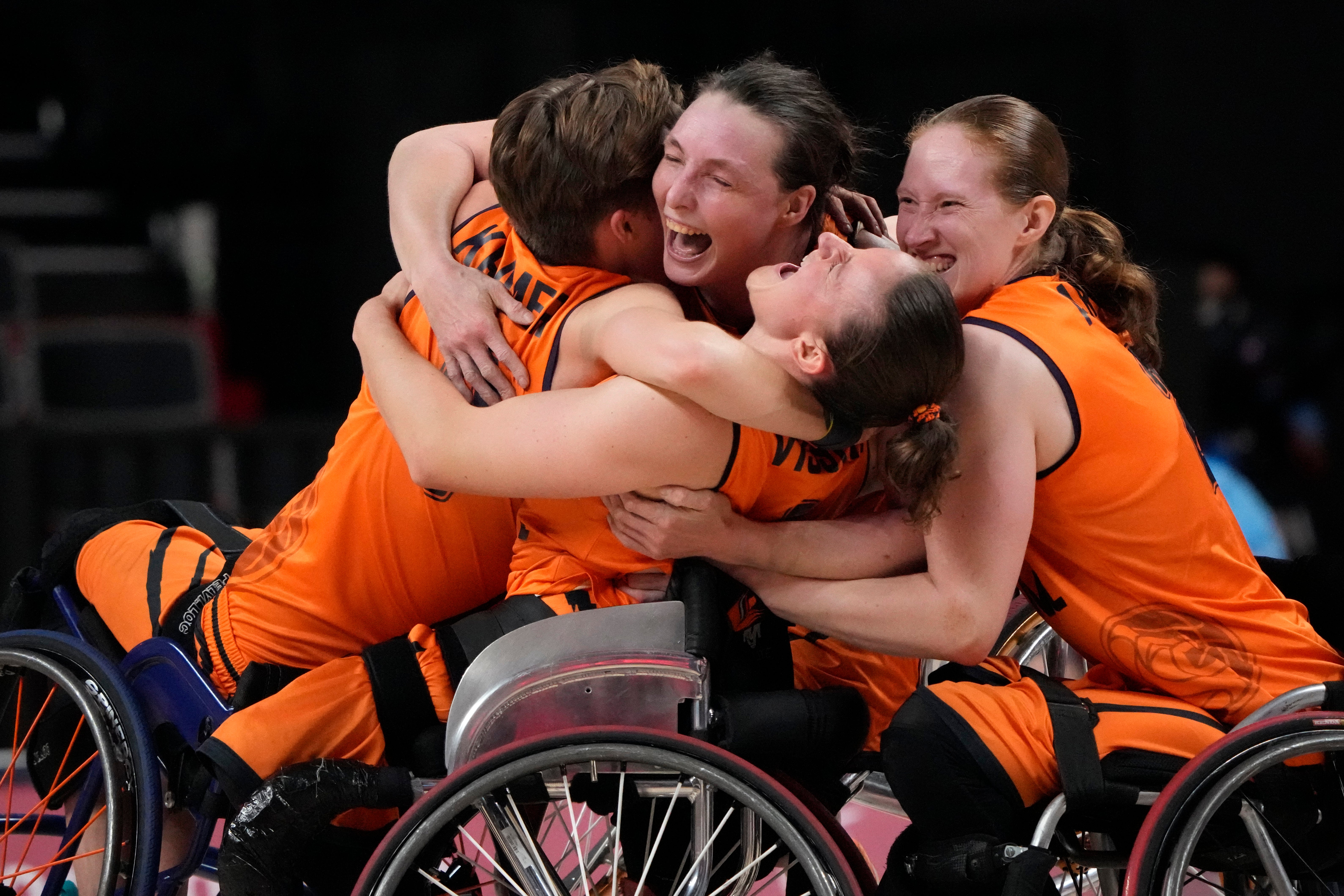 Holland celebrate after defeating Germany in the women’s wheelchair basketball semi-final (Kiichiro Sato/AP)