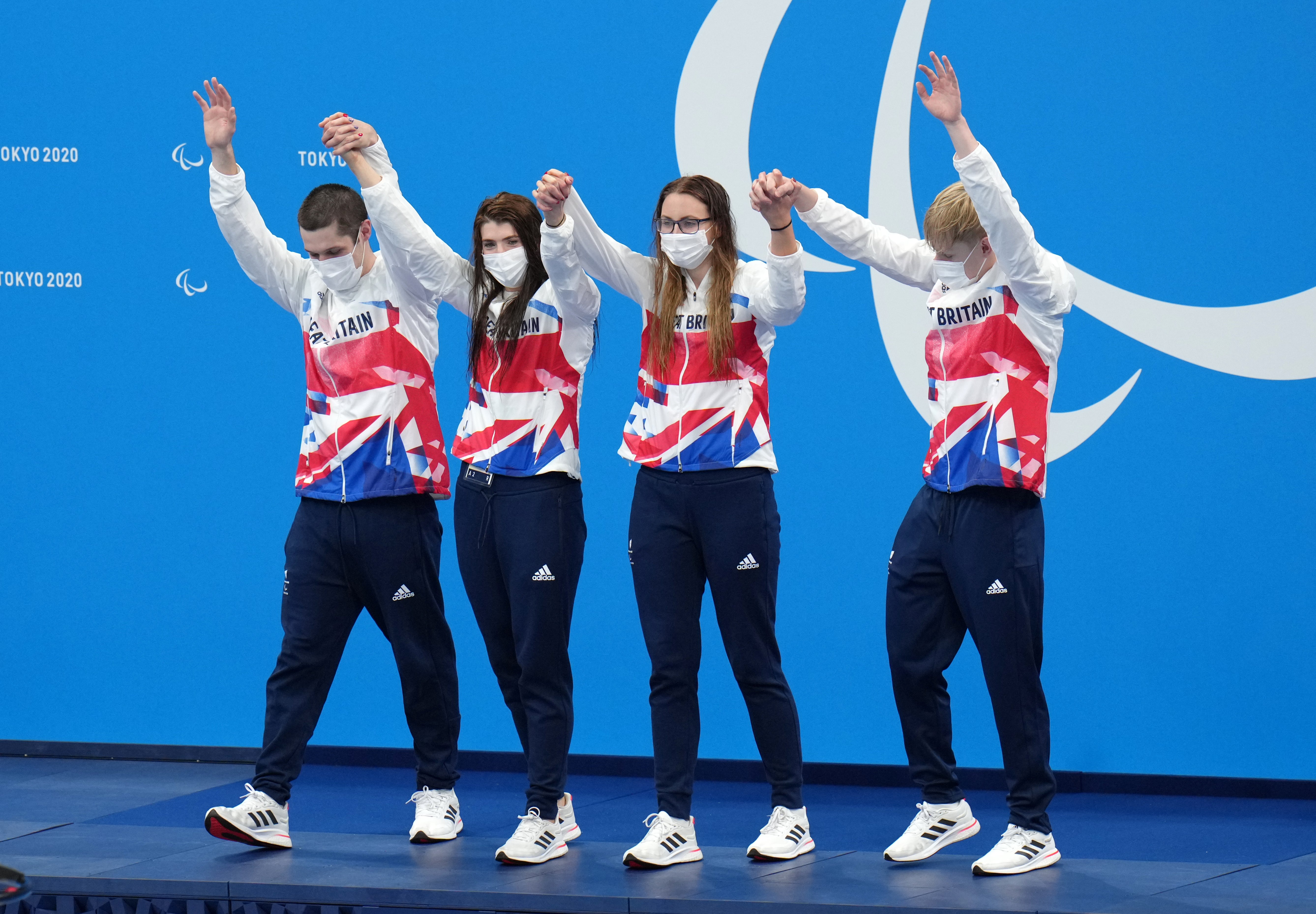 Great Britain’s Reece Dunn (left), Bethany Firth, Jessica-Jane Applegate and Jordan Catchpole after winning gold during the mixed 4x100m freestyle – S14 (Tim Goode/PA)