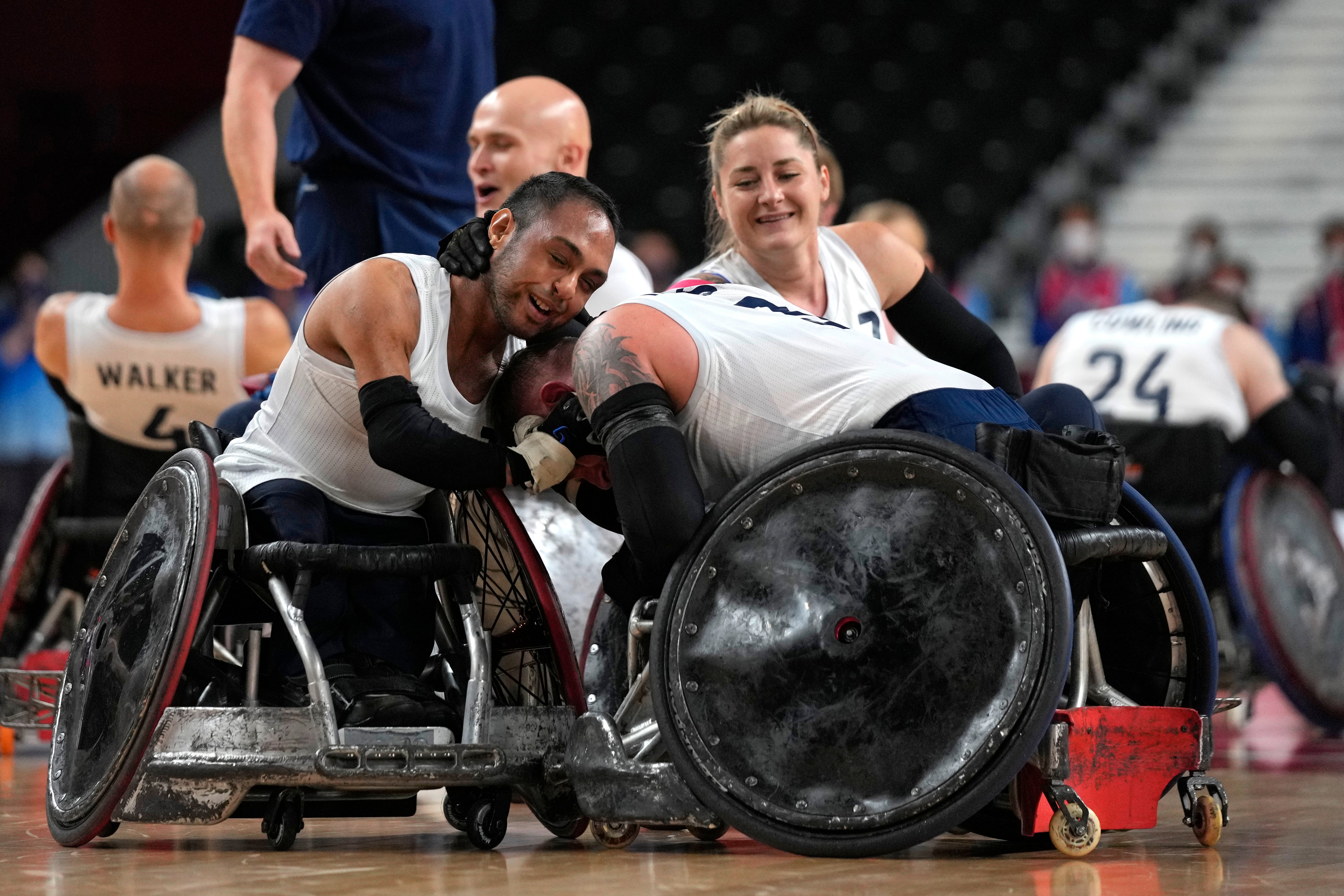 Britain’s Ayaz Bhuta (left) and Stuart Robinson celebrate after winning the wheelchair rugby gold medal match against the US (Shuji Kajiyama/AP)