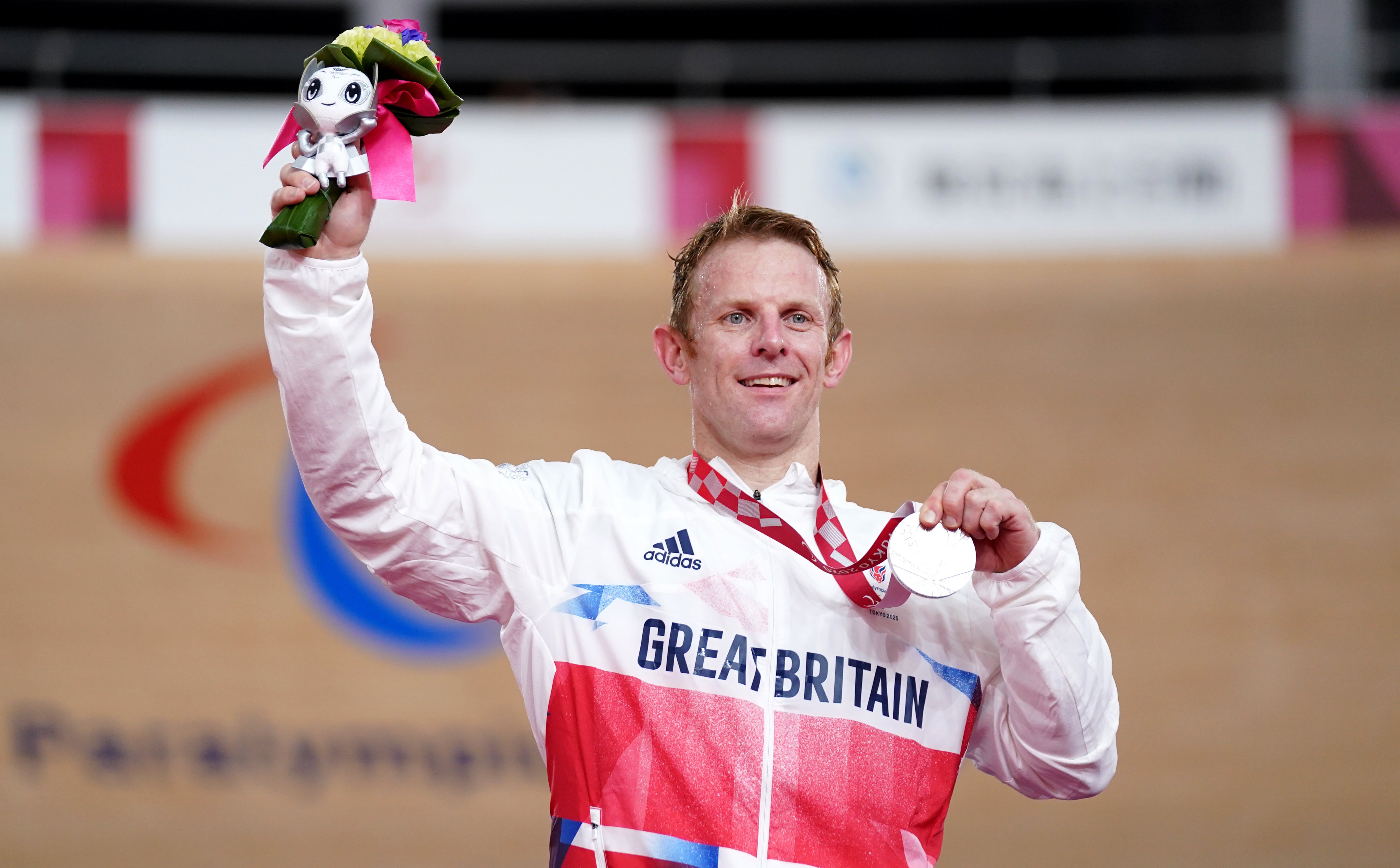 Jody Cundy celebrates on the podium with his silver medal following the men’s C4/C5 1000m time trial (Tim Goode/PA)